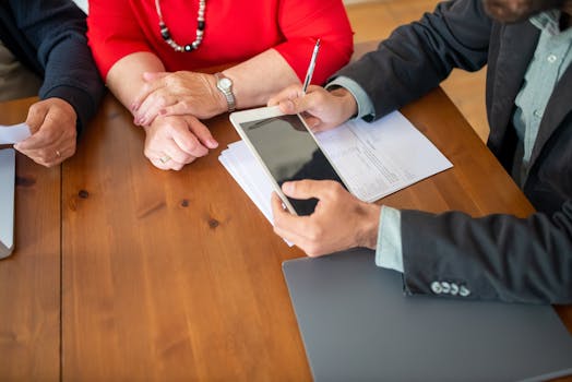 consultant with client discussing strategy