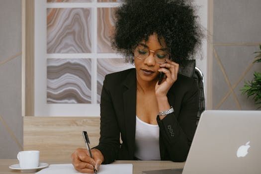 a busy woman working on her laptop