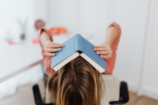 woman at a desk feeling overwhelmed