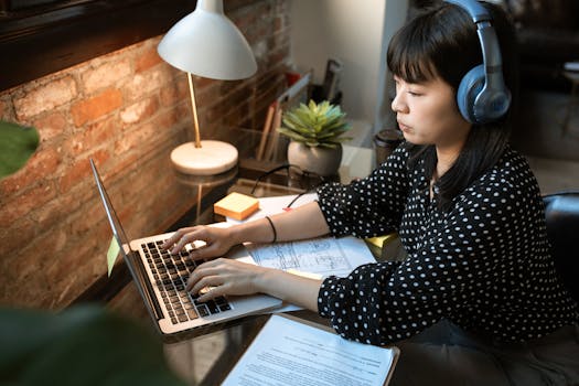 woman working on a laptop in a cozy office space